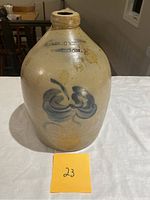 Front view image of the jug showing the brand stamp and blue floral design
