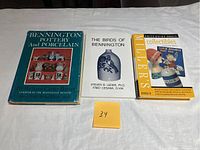 Three books laid flat on a white surface: 'Bennington Pottery and Porcelain,' 'The Birds of Bennington,' and 'Miller's Collectibles Price Guide 2002-03'.