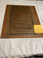 Front view of the solid wood tavern rules sign showing the printed rules text and wood grain framing.