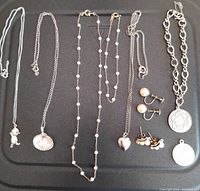 Overview of all jewelry pieces on black background