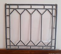 Front view of the stained glass window panel showing leaded clear glass and diamond pattern.