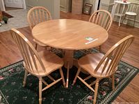 Front view of the 40-inch round table with four chairs