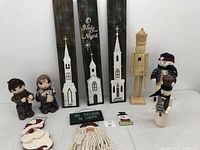 Photo of entire Christmas-themed decorative lot showing wooden signs, figurines, and ornaments.
