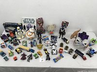 Overview of all the toys showing varied characters and vehicles, including Star Wars items and Disney toys.