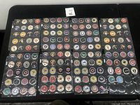 Multiple plastic sheets with NFL team logo pogs, each pog featuring a different team or Super Bowl logo.