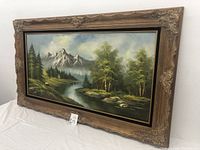 Frontal angle of the entire oil painting showing the mountain, river, trees, and ornate frame