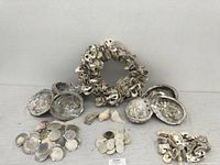 Front view showing the seashell wreath and various loose seashell groups arranged in front.