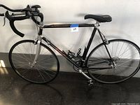 Full side view of bike showing frame, wheels, handlebars