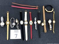 Full lot overview showing all 13 women's watches varying in style, strap, and color.