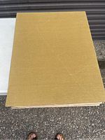 Top view of a large mustard-yellow cloth hardcover book showing cover and approximate size.