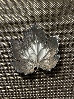 Top view of the sterling silver leaf-shaped salt dish showing detailed veins and leaf texture.