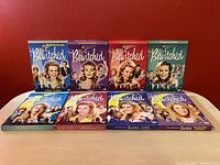 Front view of all 8 Bewitched TV series DVD cases showing cover art and characters