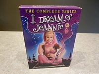 Front side of the purple box featuring Jeannie character artwork and title 'The Complete Series'.
