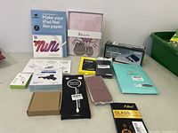 Full lot showing packaging and various accessories including cases, screen protectors, cables, and adapter boxes.