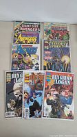 Lot of 11 Marvel comic books arranged in two rows showing front covers with characters Avengers, Thor, X-Men, and Wolverine.