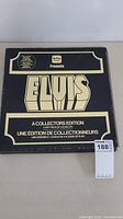 Closed black presentation box with bold gold-white "ELVIS" lettering and collectors edition details.