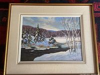 Full view of framed oil painting showing winter creek landscape