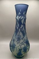 Full view of the tall cameo glass vase showing floral blue pattern on frosted glass