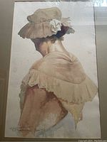 Full view of the signed original watercolour painting showing a woman from behind with hat and shawl, framed with visible stains under glass.