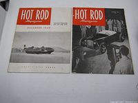 Two Hot Rod magazines side by side, December 1949 and January 1951 editions, visible wear and damage on covers.