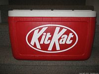 Front view of red cooler with large white Kit Kat logo on the side.
