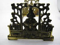 Front view of the book rack showing scholar figure seated with bookshelves on each side