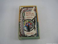 Top view of the vintage Native American Tarot Deck box with colorful tribal design and text on the front.