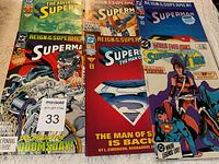 Photo showing 6 Superman comic books with varied colorful covers from Reign of the Superman and World's Finest Comics series.
