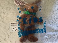 Front view of sealed Avon Kids plush moose toy in original packaging highlighting product and branding on plastic bag.