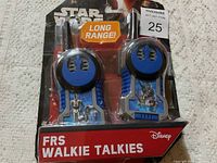 Front view of two Star Wars themed FRS walkie talkies in packaging with visible Rebel Alliance symbol and long range claim.
