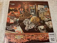 Front cover of the Discreet vinyl album showing the detailed surreal artwork and condition of the album cover.