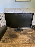 Front view of a Dell monitor showing a black screen and the Dell logo on the bottom bezel.