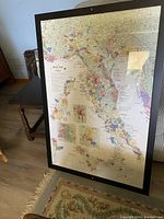 Framed Italy wine map showing colorful wine regions across Italy with detailed insets.