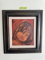 Photo of framed child portrait painting with a black frame and white mat, dimensions 17.5 x 19.5 inches included.