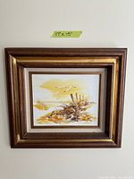 Photo of a seagull painting with a brown and gold wooden frame, showing the painting size taped above as 17 x 15 inches.