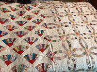 Both quilts laid out side by side showing overall designs