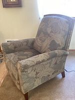 Front-angle view showing overall form, upholstery pattern, and leg style