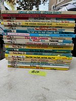 Stack of 21 mostly children's books, prominently featuring Dr. Seuss, Berenstains and other classic kids titles.