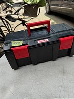 Closed front view of the black and red Qorex tool box with handle and latches visible, labeled #255.