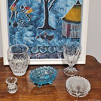 Overall view of all 5 crystal and glass items together, showing vase, toothpick holder, candy dish, goblet, and trinket box