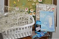 All items showing the laundry basket, coat and gown bags, silver duster and mop sponge