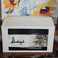 Box top with Slumberjack logo and vintage image printed.