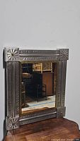 Full view of the rectangular Mexican tin tile wall mirror showing the detailed metal frame and reflective glass.