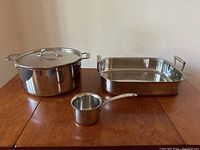 All three cookware pieces displayed on table