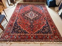 Full view of rug laid flat showing overall design, color and size