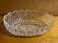 Oval bowl angled front view showing scalloped rim and diamond cut pattern