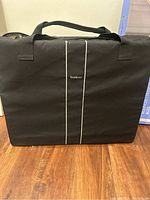 Black BabyBjörn carrying case with logo