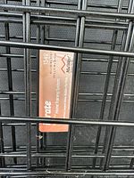 Close-up of the MidWest brand label on the crate showing model 1542 and dimensions 42x28x30 inches.