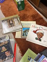 Photo of Christmas music themed vinyl LPs, including Mormon Tabernacle Choir albums and a Merry Christmas album with Santa Claus cover.