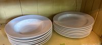 6 stacked white IKEA soup bowls roughly 12 inches in diameter with smooth round edges.